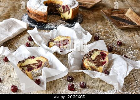 pieces of marble cake on wooden rustic background from above Stock Photo