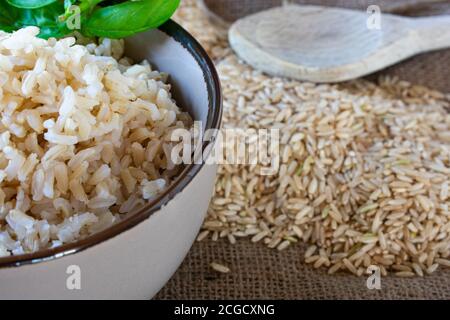 cooked and uncooked brown basmati rice Stock Photo