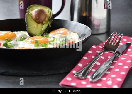 Ketogenic Breakfast Fried eggs sunny side up with a mug of coffee Stock Photo