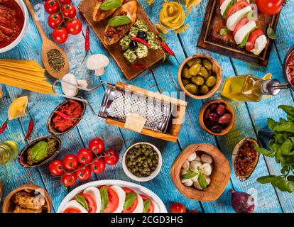 Various kind of italian food served on wood. Top view, free space for text Stock Photo