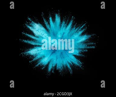 Explosion of blue powder isolated on black background. Abstract colored background Stock Photo