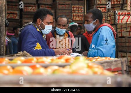 Addis Ababa, Ethiopia. 9th Sep, 2020. People get busy ahead of Ethiopia's New Year celebrations at Atkilt Tera market in Addis Ababa, capital of Ethiopia, Sept. 9, 2020. The Ethiopian New Year, or Enkutatash in Amharic language, falls on Sept. 11 (or Sept. 12 during a leap year), as the East African nation uses a unique calendar that counts its year seven to eight years behind the Gregorian calendar. Credit: Michael Tewelde/Xinhua/Alamy Live News Stock Photo