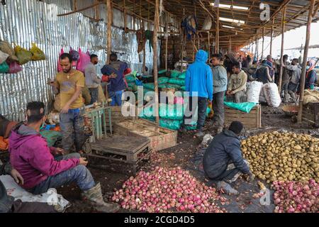 Addis Ababa, Ethiopia. 9th Sep, 2020. Vendors and buyers get busy ahead of Ethiopia's New Year celebrations at Atkilt Tera market in Addis Ababa, capital of Ethiopia, Sept. 9, 2020. The Ethiopian New Year, or Enkutatash in Amharic language, falls on Sept. 11 (or Sept. 12 during a leap year), as the East African nation uses a unique calendar that counts its year seven to eight years behind the Gregorian calendar. Credit: Michael Tewelde/Xinhua/Alamy Live News Stock Photo