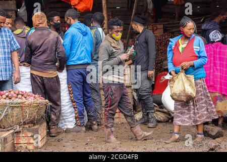 Addis Ababa, Ethiopia. 9th Sep, 2020. Vendors and buyers get busy ahead of Ethiopia's New Year celebrations at Atkilt Tera market in Addis Ababa, capital of Ethiopia, Sept. 9, 2020. The Ethiopian New Year, or Enkutatash in Amharic language, falls on Sept. 11 (or Sept. 12 during a leap year), as the East African nation uses a unique calendar that counts its year seven to eight years behind the Gregorian calendar. Credit: Michael Tewelde/Xinhua/Alamy Live News Stock Photo