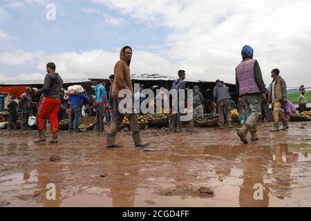 Addis Ababa, Ethiopia. 9th Sep, 2020. Vendors and buyers get busy ahead of Ethiopia's New Year celebrations at Atkilt Tera market in Addis Ababa, capital of Ethiopia, Sept. 9, 2020. The Ethiopian New Year, or Enkutatash in Amharic language, falls on Sept. 11 (or Sept. 12 during a leap year), as the East African nation uses a unique calendar that counts its year seven to eight years behind the Gregorian calendar. Credit: Michael Tewelde/Xinhua/Alamy Live News Stock Photo