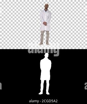 Standing young serious arab doctor, Alpha Channel Stock Photo