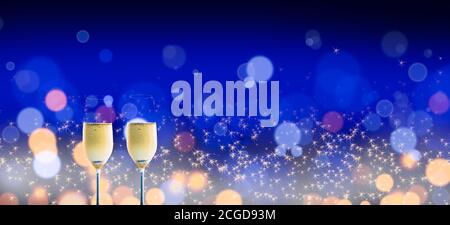 Two glasses of chilled champagne on a shimmering blurred lights, blue background. Stock Photo