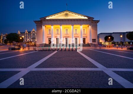 Night view of illuminated Town Hall in the Town Hall Square in the Old Town of Vilnius, Lithuania Stock Photo