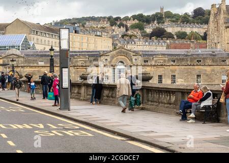 Tourist near Pulteney Bridge in the City of  Bath, Somerset, England, UK Stock Photo