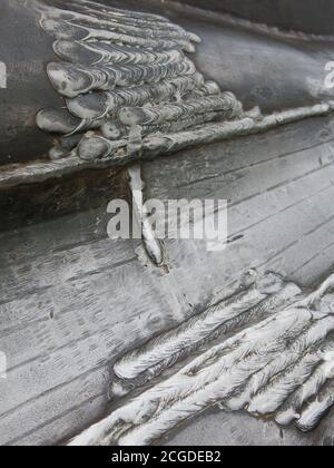 Detail of the metalwork in Maggi Hambling's steel shell sculpture "Scallop", a public art installation on the beach at Aldeburgh, Suffolk. Stock Photo