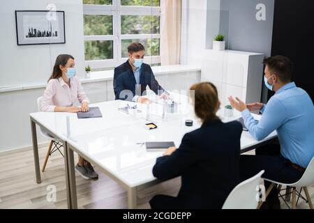 Face Mask Office Social Distancing Meeting Or Interview Stock Photo