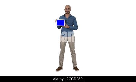 Smiling casual man presenting a tablet with a blank screen on white background. Stock Photo
