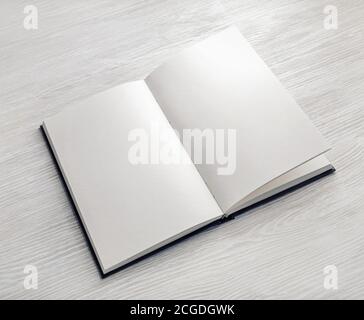 Mockup of opened blank booklet on light wooden background. Stock Photo