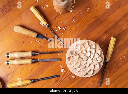 Collection of woodworking tools. Wooden box drawing a flower. Stock Photo