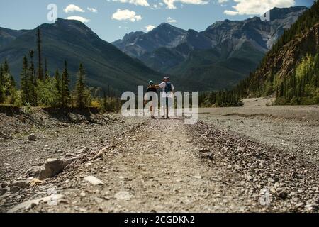 Father and son walking in the mountains Stock Photo