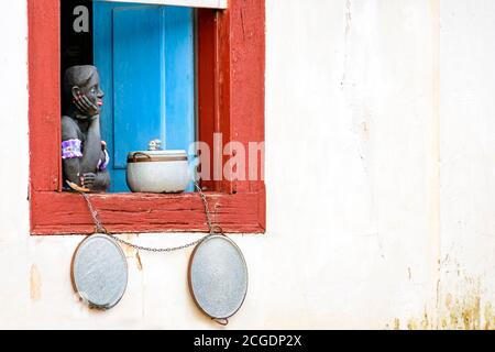 Window decorated with flowers and objects in the historic city of Tiradentes typical of the interior of the state of Minas Gerais Stock Photo