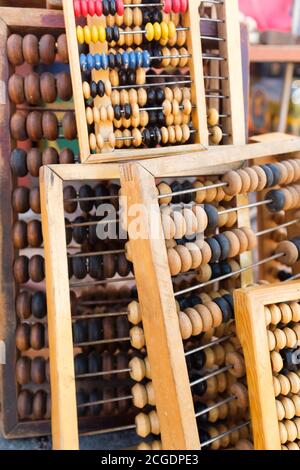 retro wooden abacus lie in a heap on the ground Stock Photo