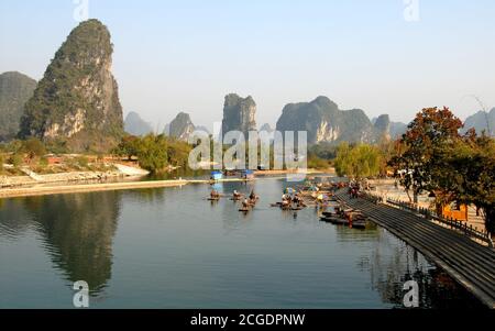 Bamboo rafts on the Yulong River near Yangshuo, Guilin in Guangxi Province, China. This is the terminus for the bamboo raft ride along the river. Stock Photo
