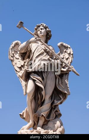 Rome, Italy - June 28, 2010: One of the famous statues of angels, the one with the sponge, on the Sant'Angelo bridge near the Castle of the same name. Stock Photo