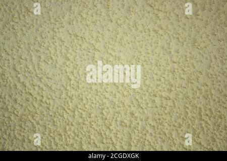 Close-up of yellow painted wall. Background, texture. Stock Photo