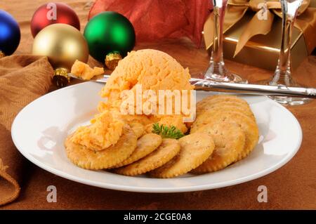 A cheddar cheese ball and crackers at Christmas Stock Photo