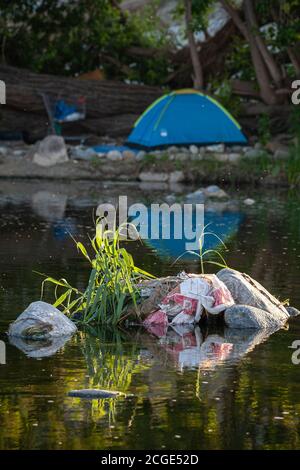 Homeless camp along Los Angeles River, Glendale Narrows, Los Angeles, California, USA Stock Photo