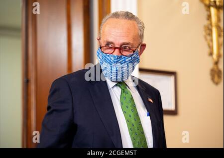 Senator Chuck Schumer (D-NY) wearing a New York State themed face mask at a press conference to present a 'clean, just economic recovery plan.' Stock Photo