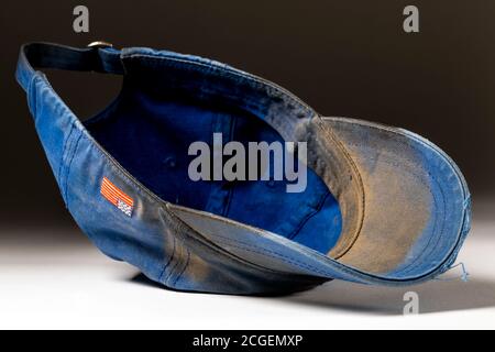 Studio still life of old worn & dirty baseball hat Stock Photo