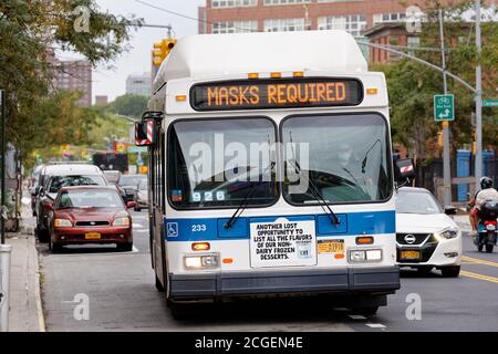 Masks required on bus sign for Covid restrictions Stock Photo