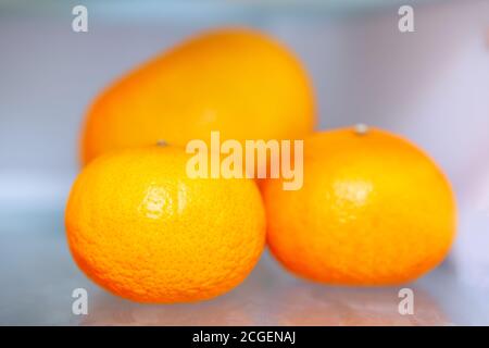 Three oranges . Exotic fruits ready to eat Stock Photo