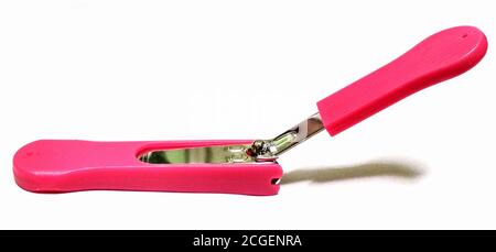 A pink nail clipper on white background Stock Photo