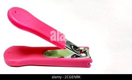 A pink nail clipper on white background Stock Photo