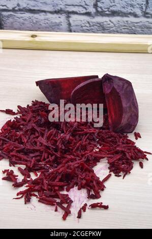 fresh beet grated, grate beetroot on a grater Stock Photo