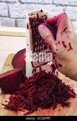 fresh beet grated, grate beetroot on a grater Stock Photo