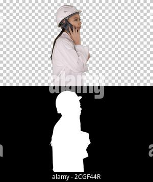Female science engineer making a call while walking, Alpha Channel Stock Photo