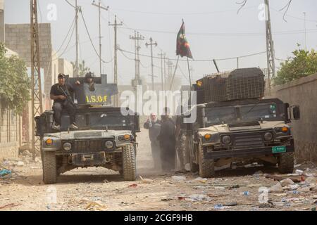 Iraqi Special Forces vehicles during the early days of the Mosul Operation in Al Bakir district of East Mosul, Iraq. Stock Photo