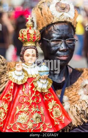 A reveler in costume during the Ati-atihan Festival in Kalibo, Aklan, Philippines. The event is held every third Sunday of January. Stock Photo