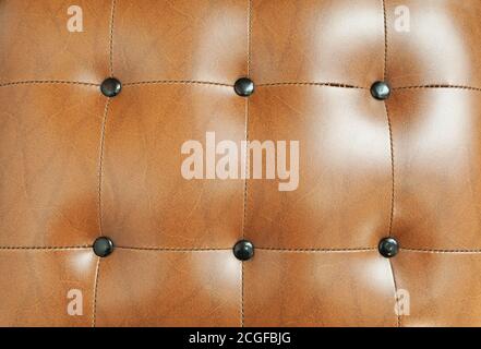 Light brown leather background texture with buttons Stock Photo