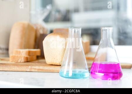 Chemical flasks for analysis of quality of bread and baking products Stock Photo