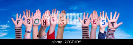 Children Hands Building Word Frohes Fest Means Merry Christmas, Blue Sky Stock Photo