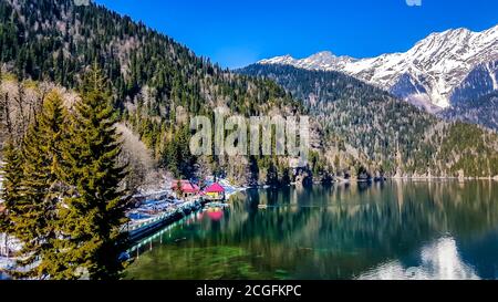 Lake Ritsa in the Caucasus Mountains, in the north-western part of Abkhazia, surrounded by mixed mountain forests and subalpine meadows. Stock Photo