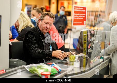 Potsdam, Germany. 10th Sep, 2020. Claudius Dreilich (Karat) is committed to helping socially disadvantaged people. For the campaign 'Deutschland rundet auf' the band members sit at the cash desk and collect money in the Kaufland of Potsdam's main station. Credit: Gerald Matzka/dpa-Zentralbild/ZB/dpa/Alamy Live News Stock Photo