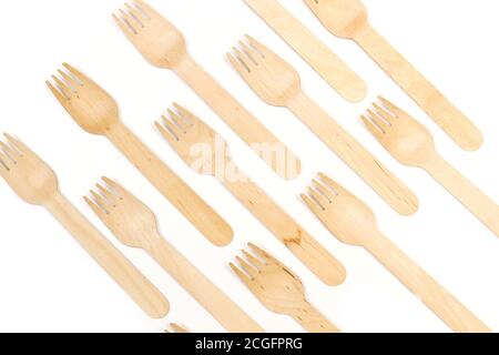 Wooden forks on a white background in a top view Stock Photo