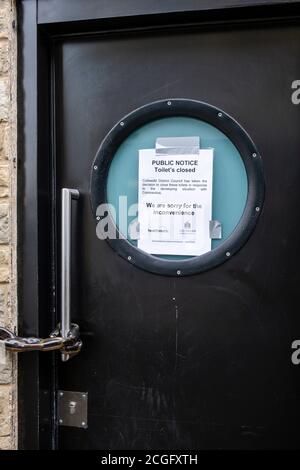 Shop windows in the town of Cirencester with various notices to the public about thier clousre due to the Covid-19, Coronavirus outbreak and subsequent lock down across the UK. Stock Photo