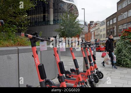 New Voi electric dockless scooters parked outside New Street Station, Birmingham. The rental system  began in Birmingham & Coverntry in September 2020 Stock Photo
