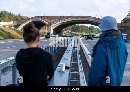 Dolle, Germany. 10th Sep, 2020. Two women from a film team are standing on the Autobahn 14, where scenes for the German-Polish mystery thriller "Lipstick on the Glass" are being shot on the newly built section of the highway. On Monday, October 14, 2020, the eight-kilometer section between Colbitz and Tangerhütte will then be opened to traffic in the presence of Federal Transport Minister Scheuer. Credit: Stephan Schulz/dpa-Zentralbild/ZB/dpa/Alamy Live News Stock Photo