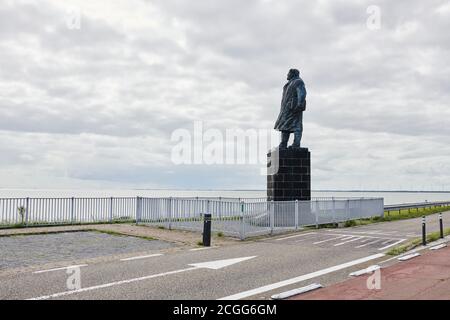 Afsluitdijk in the Netherlands with statue of Engineer Cornelis Lely Stock Photo