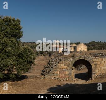 Ruins of the church 'Santa Maria do Castelo' and ruined wall arch inside of the castle complex in Castelo Mendo. It is one of the historic villages of Stock Photo