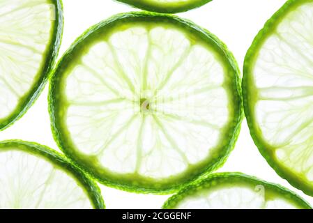 Green lime slices isolated on white background. Stock Photo