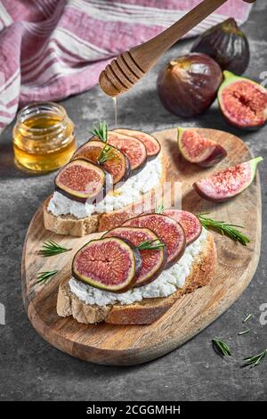 Bread With Cottage Cheese, Figs and Honey Stock Photo